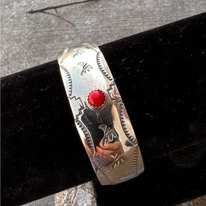 Navajo Sterling Silver Engraved bracelet. A petite Red Coral Stone in middle.